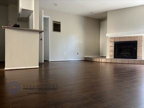 Los Angeles apartment for rent - A living room with a fireplace and a wooden floor.